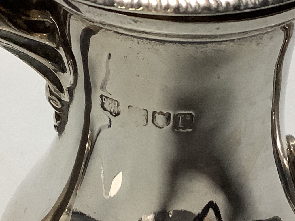 A George V silver café au lait pair of balluster form, Daniel and John Welby, London, 1912, height 21.4 cm, weighted